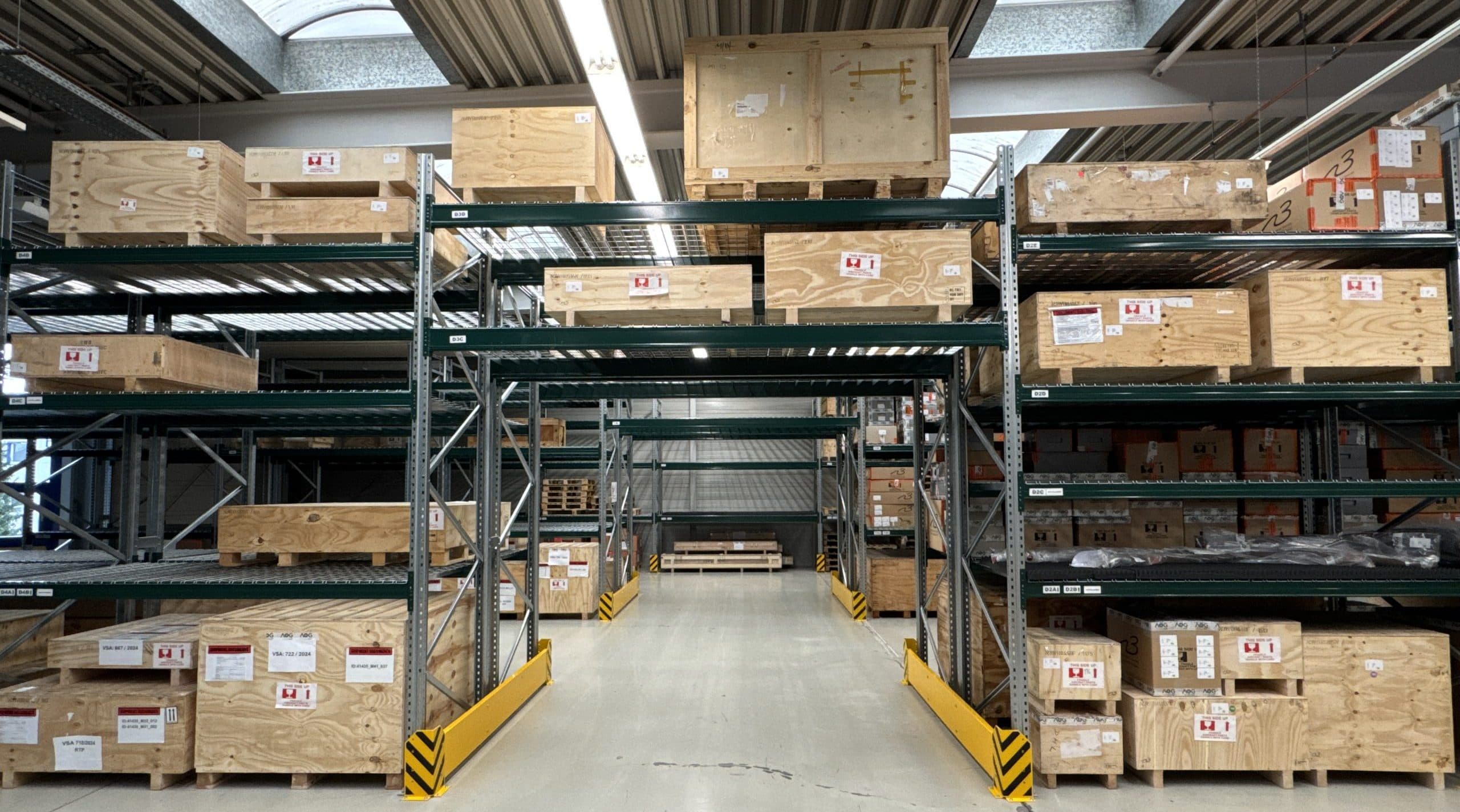 Crated parts on warehouse racking at AOG-247 Europe GmbH