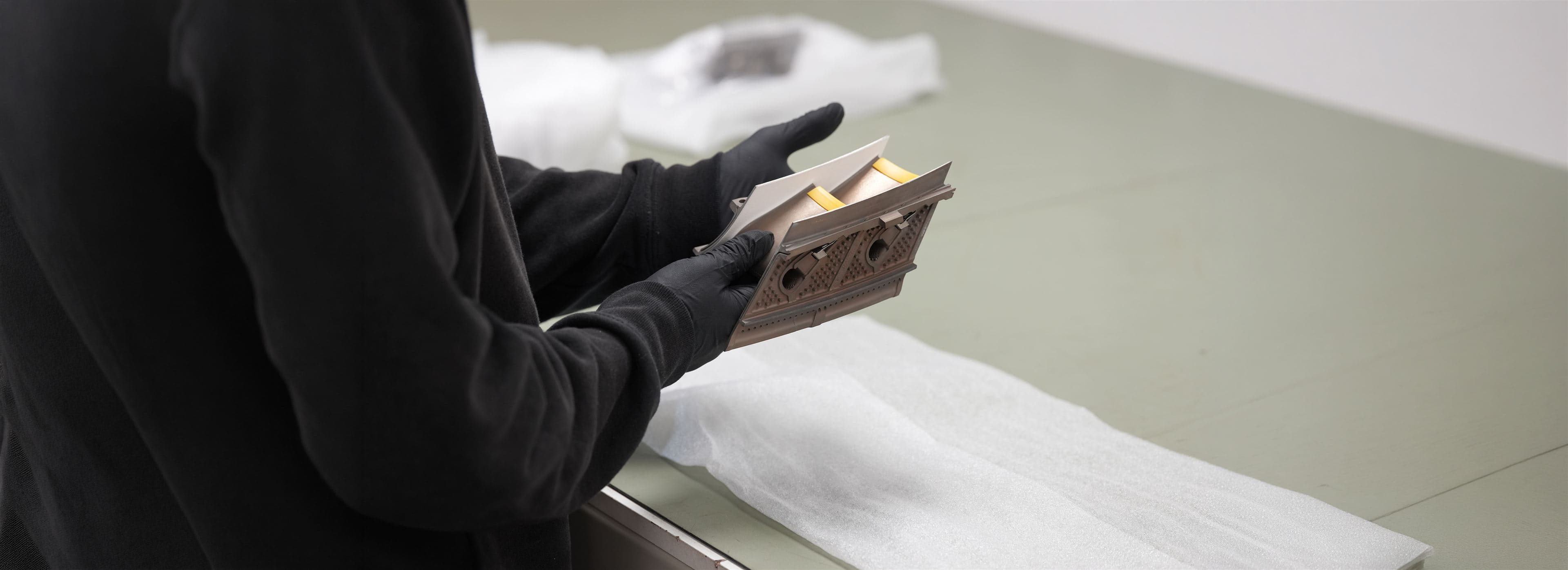 A technician inspecting an engine module component