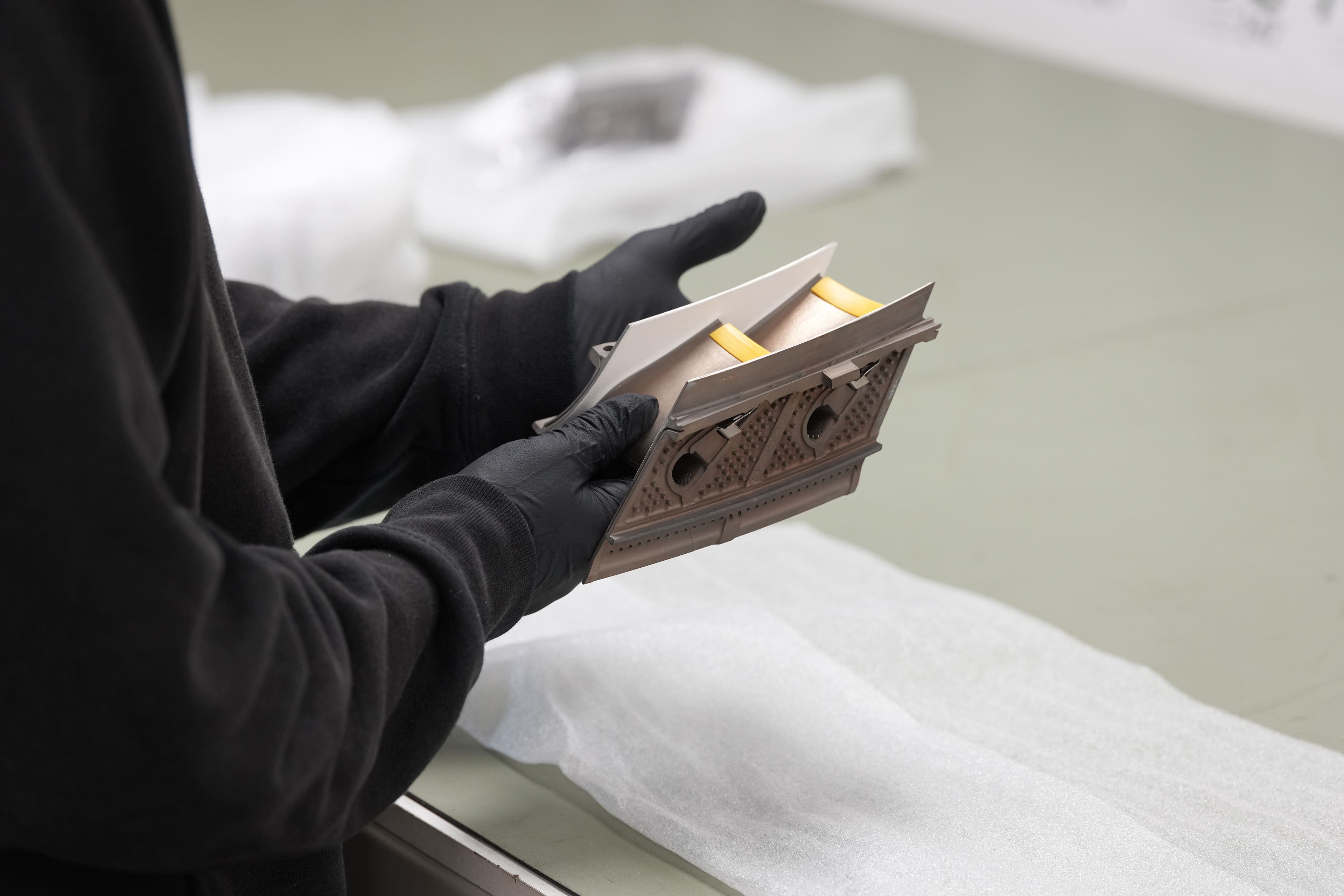 A technician inspecting an engine component